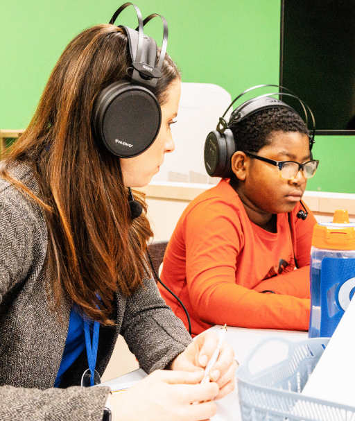 Educator observing student during tutoring